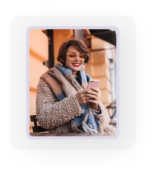 Woman enjoying coffee while using phone